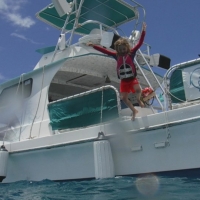 Camille jumping off the boat